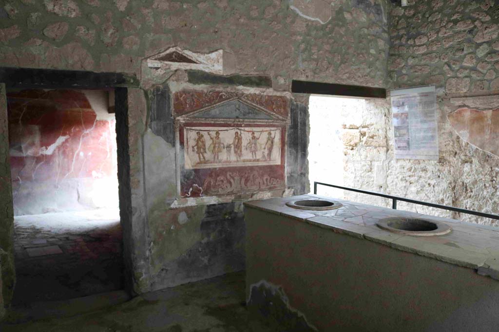 I.8.8 Pompeii. December 2018. 
Rear wall of bar-room, doorway to rear room, on left, doorway to oecus, atrium and dwelling, on right. Photo courtesy of Aude Durand.