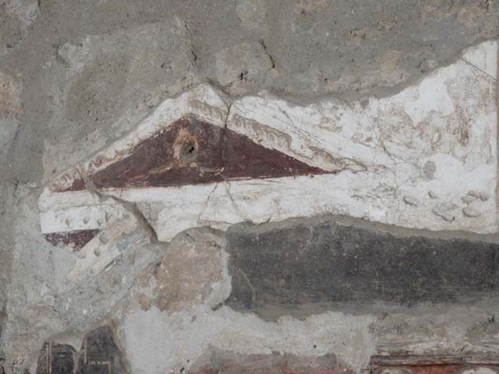 I.8.8 Pompeii. May 2015. Detail of wall decoration from south wall above lararium.
Photo courtesy of Buzz Ferebee.