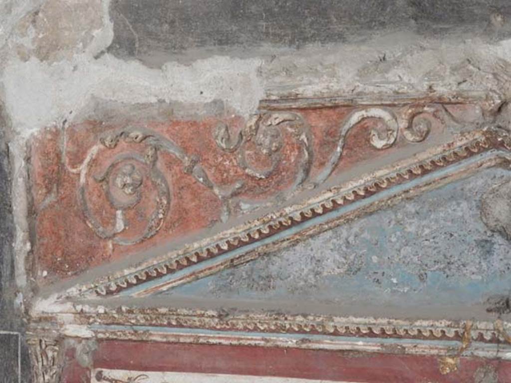 I.8.8 Pompeii. May 2015. Detail of stucco decoration on south wall, with east side of pediment above lararium. Photo courtesy of Buzz Ferebee.