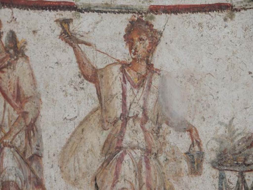 I.8.8 Pompeii. May 2015. Detail of painted figure of a Lar. Photo courtesy of Buzz Ferebee.