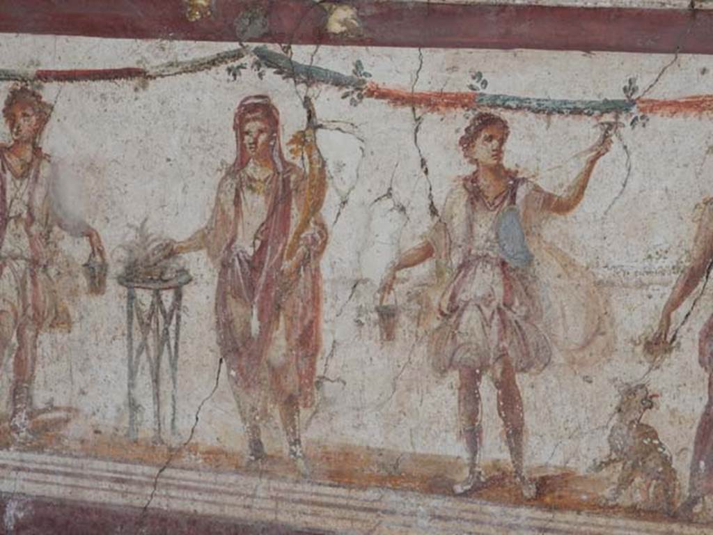 I.8.8 Pompeii. May 2015. Detail of the central figure of the Genius of the household with Lares on either side.  Photo courtesy of Buzz Ferebee.