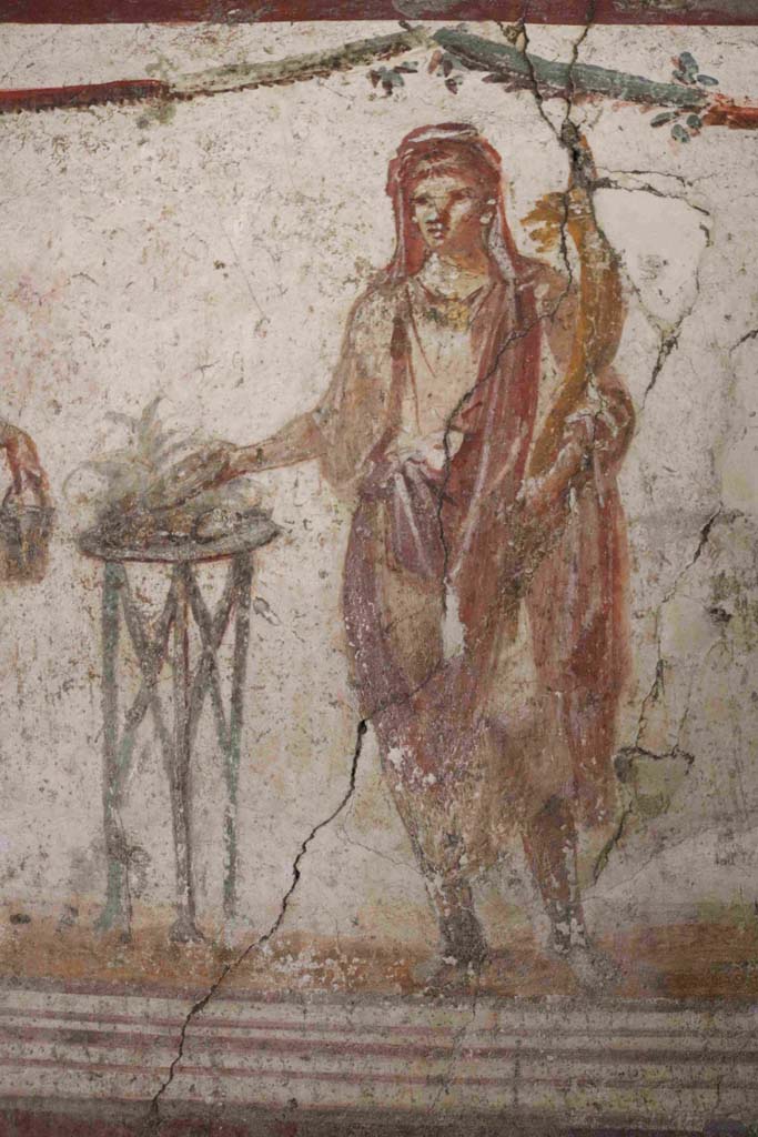 I.8.8 Pompeii. December 2018. Detail of the painted figure of the Genius of the household. Photo courtesy of Aude Durand.