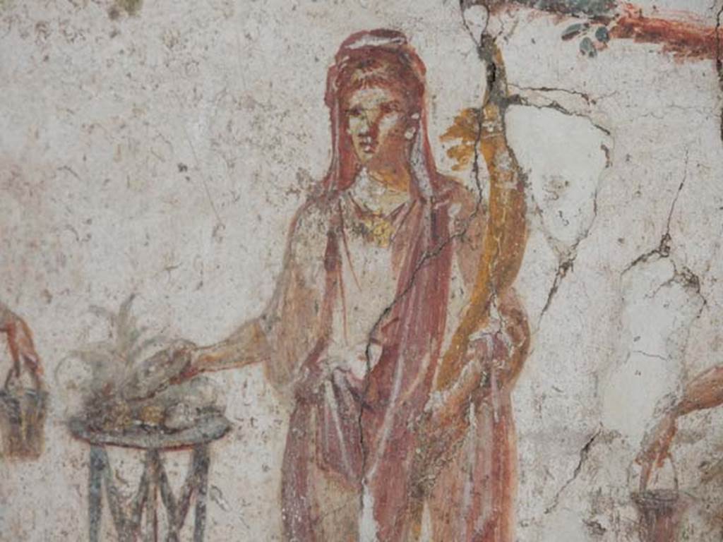 I.8.8 Pompeii. May 2015. Detail of the painted figure of the Genius of the household
Photo courtesy of Buzz Ferebee.