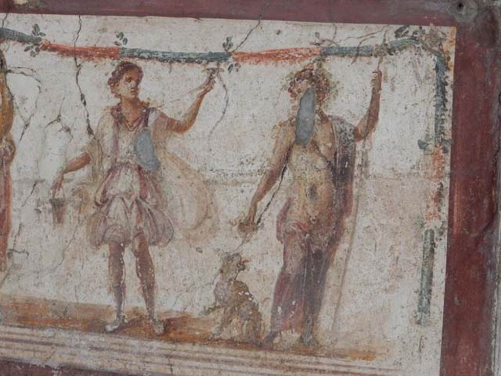 I.8.8 Pompeii. May 2015. Detail of a Lar, on left, and with Bacchus with panther drinking from cup, on right. Photo courtesy of Buzz Ferebee.