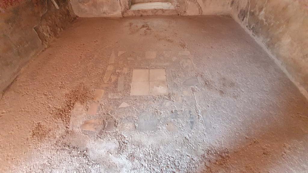I.8.8 Pompeii. July 2021. Room 3, floor of rear room of caupona, looking north. 
According to PPM, the floor was made of cocciopesto ornamented with small white tesserae.
In the centre was an emblema in opus sectile, in the centre of which were coloured marble squares, around the edge was a border of a line of white tesserae.
Foto Annette Haug, ERC Grant 681269 DÉCOR.