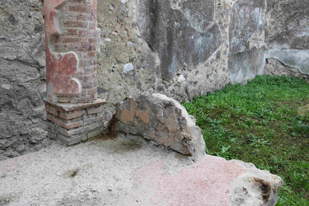 I.8.9 Pompeii. December 2018. 
Looking south-west from interior end of southern couch which also appears to have yellow plaster on. Photo courtesy of Aude Durand.