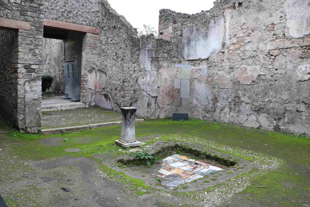 I.8.9 Pompeii. December 2018. 
Room 1, looking south-west across impluvium in atrium towards tablinum and garden area. Photo courtesy of Aude Durand.
According to PPM, the remains of the coloured marble opus sectile bottom of the impluvium were found.