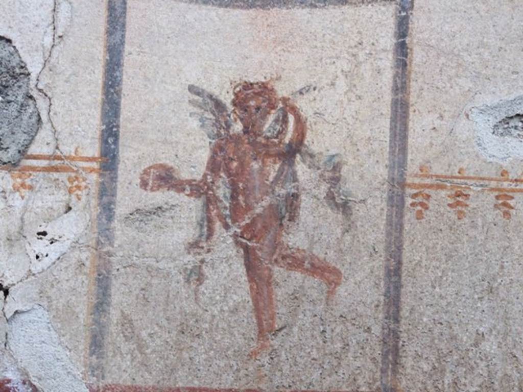 I.8.14 Pompeii. December 2007. Room 9, north wall with detail of painted figure of a cupid.