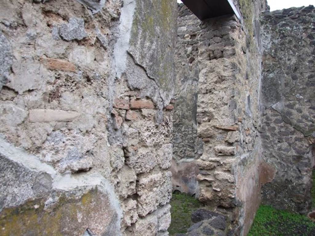 I.8.14 Pompeii. December 2007. Courtyard 7, looking west along south wall with window into atrium 2.