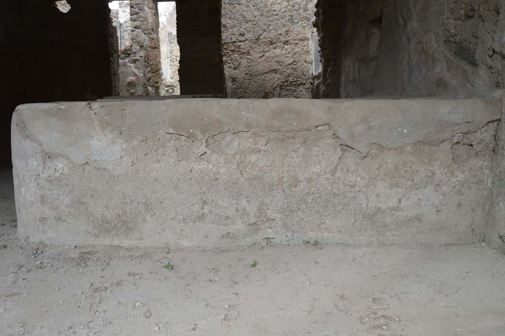 I.8.15 Pompeii. October 2017. Looking north to detail of front façade of podium in shop-room.
Foto Taylor Lauritsen, ERC Grant 681269 DÉCOR.