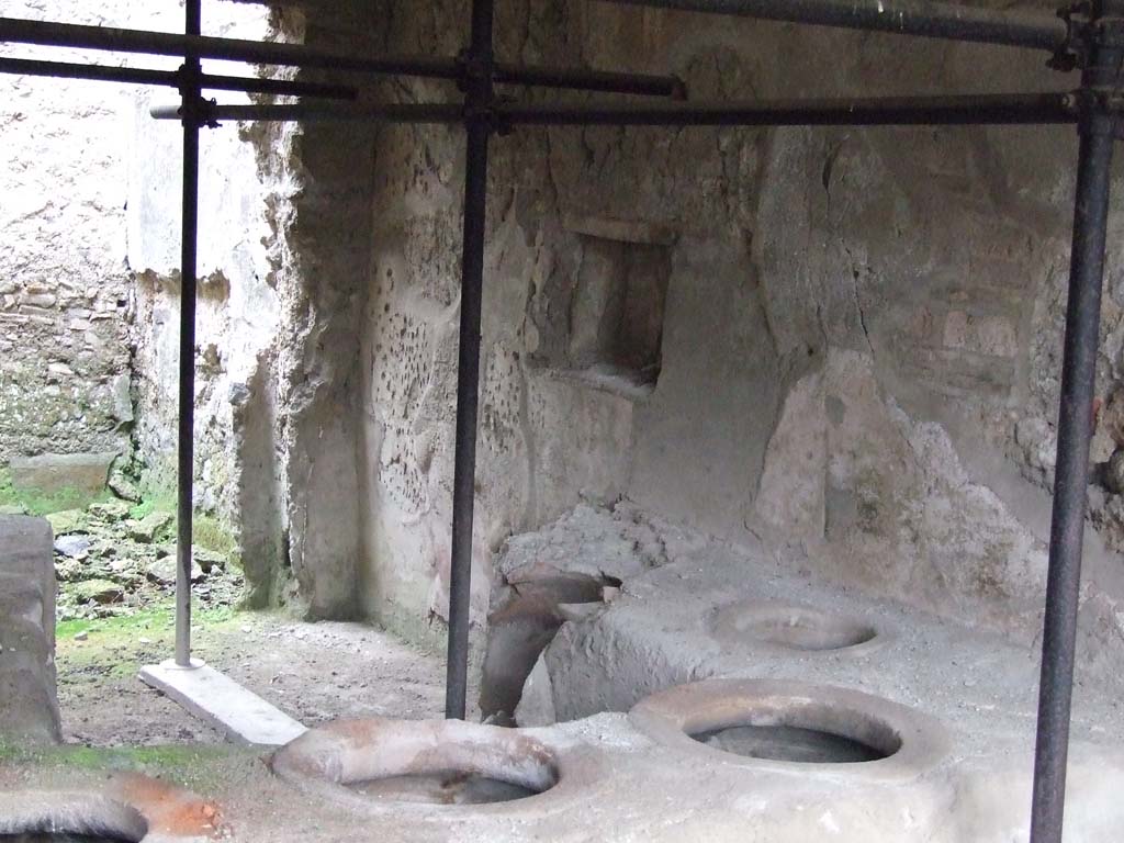 I.8.15 Pompeii. December 2007. Looking towards east wall of shop-room, with square niche.