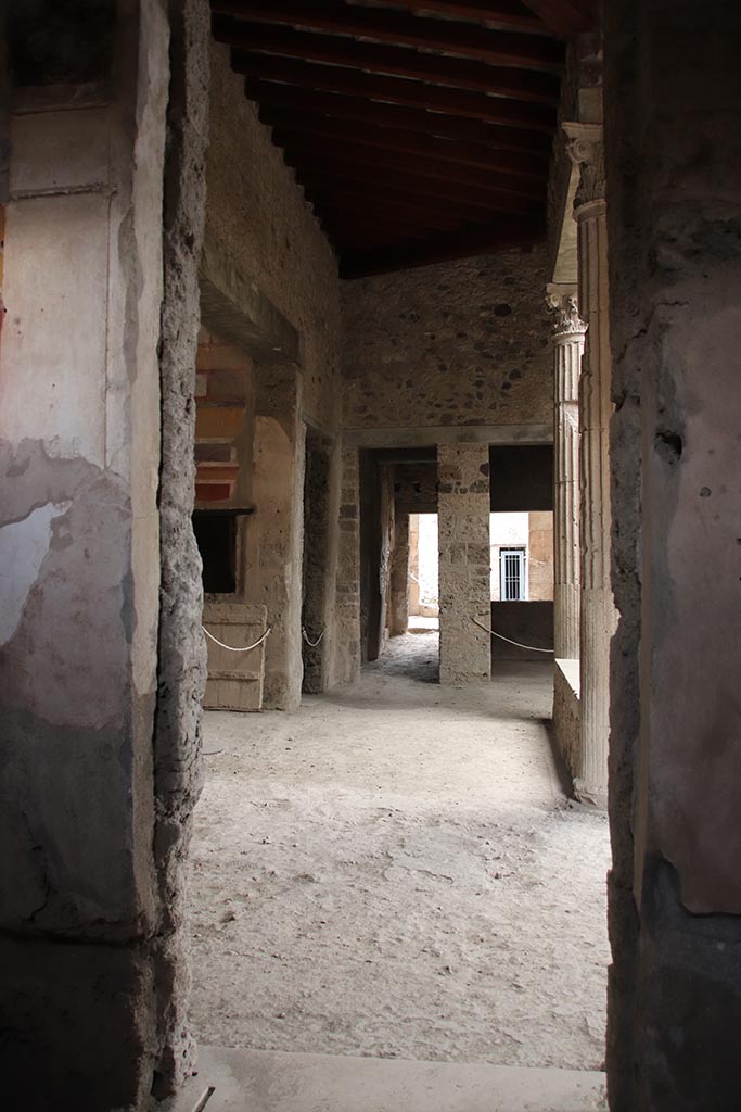 I.8.17 Pompeii. October 2024. 
Room 15, looking east through doorway, across north side of atrium. Photo courtesy of Klaus Heese.