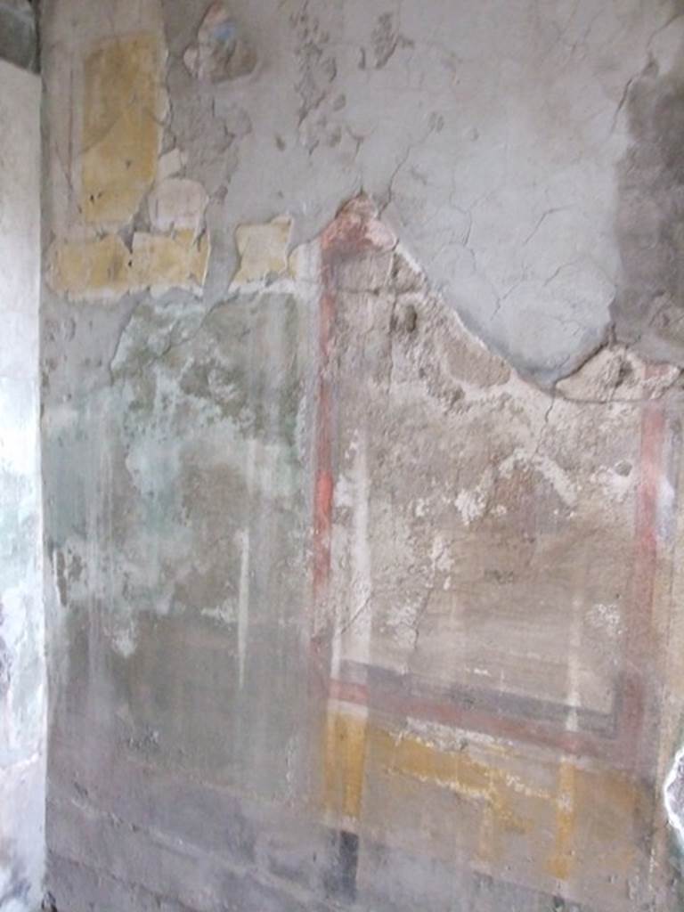 I.8.17 Pompeii. December 2007. Room 16. North wall to the west of the door.  Remains of a wall painting of Ariadne, Athena and Theseus?
See Bragantini, de Vos, Badoni, 1981. Pitture e Pavimenti di Pompei, Parte 1. Rome: ICCD. (p.87). According to Peters, from the right upper corner a large portion of the stucco is missing. Ariadne was sleeping, on the right. Theseus was standing near her, but looking left towards Athena. The yellow of Ariadne’s pillow and the carmine, yellow and green of the clothes form a vivid contrast to the sober surroundings. 
See Peters, W.J.T. (1963): Landscape in Romano-Campanian Mural Paintings.The Netherland, Van Gorcum & Comp. (p.99-100)