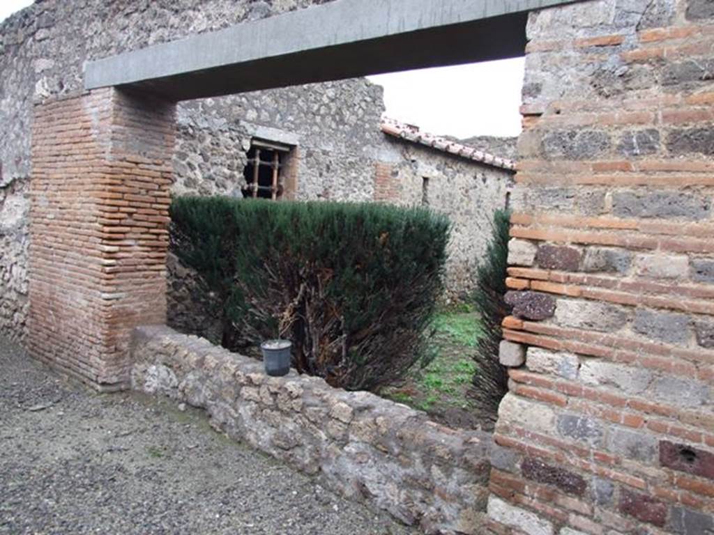 I.8.17 Pompeii. December 2007. Room 17, peristyle garden.
Looking south-east from the north end of the garden, towards windows of rooms 23, 21 and 22. These rooms were not accessible.
According to P.P.M., room 23 is decorated in the fourth style, with white walls divided into panels bordered in red and with depictions of birds, a swan and panther.
Next to it is room 21, the kitchen, and next to that is room 22, the latrine.
See Carratelli, G. P., 1990-2003. Pompei: Pitture e Mosaici: Vol. I.  Roma: Istituto della enciclopedia italiana, pp. 908-913.