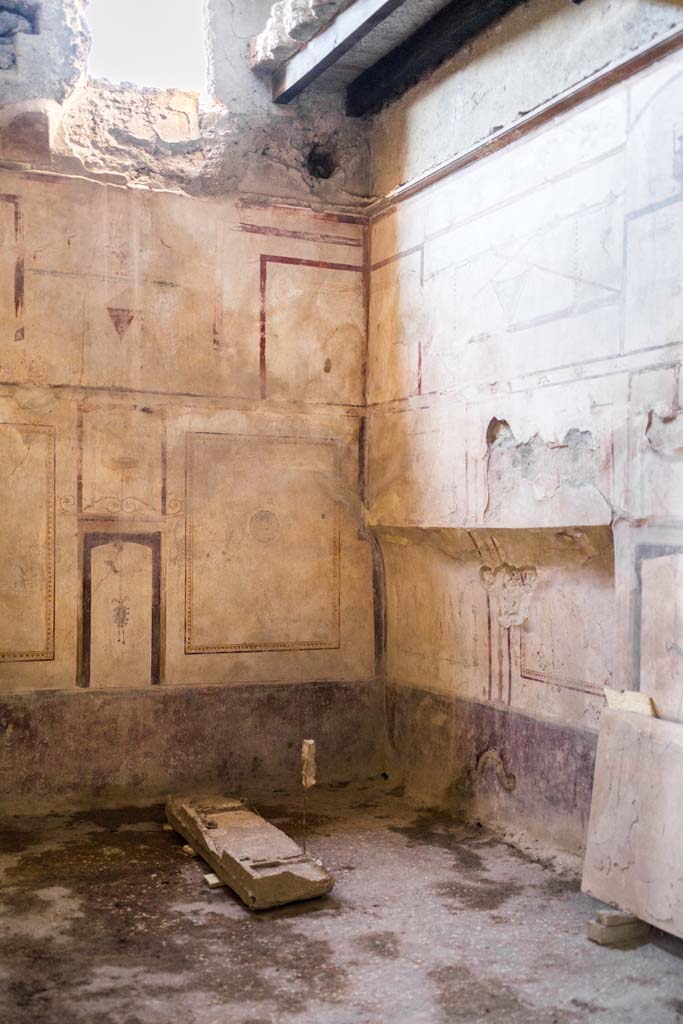 I.8.17 Pompeii. December 2021. 
Room 14, looking towards north-west corner with recess in north wall. Photo courtesy of Johannes Eber.