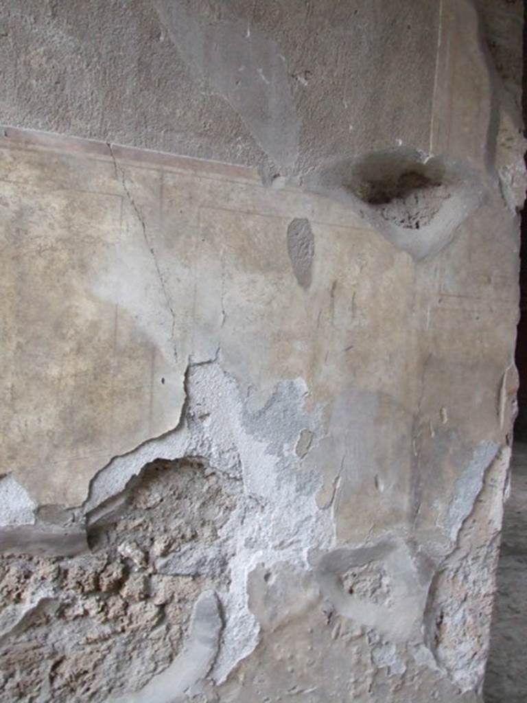 I.8.17 Pompeii. December 2007. 
Plaster on wall on north side of entrance vestibule 2.