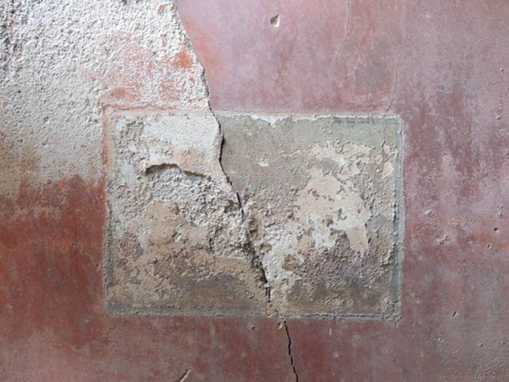I.9.1 Pompeii. March 2009.  Room 11, west wall south of door in the red middle area of the wall, remains of wall painting showing three masks.