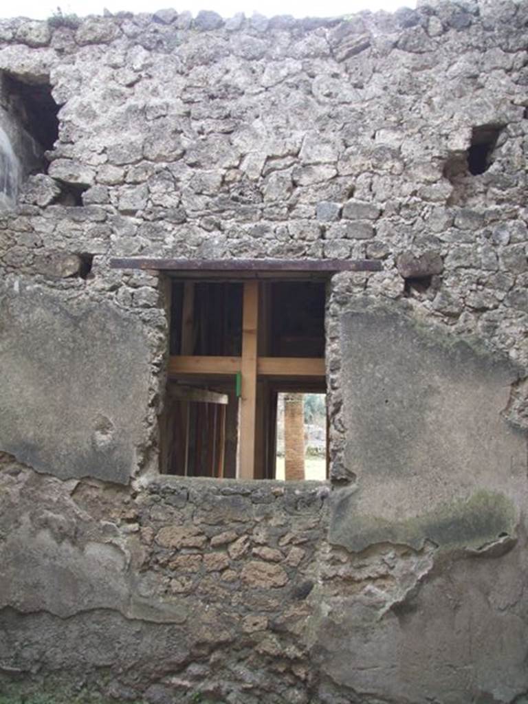 I.9.1 Pompeii.  March 2009.  Room 9. South wall with window into triclinium.