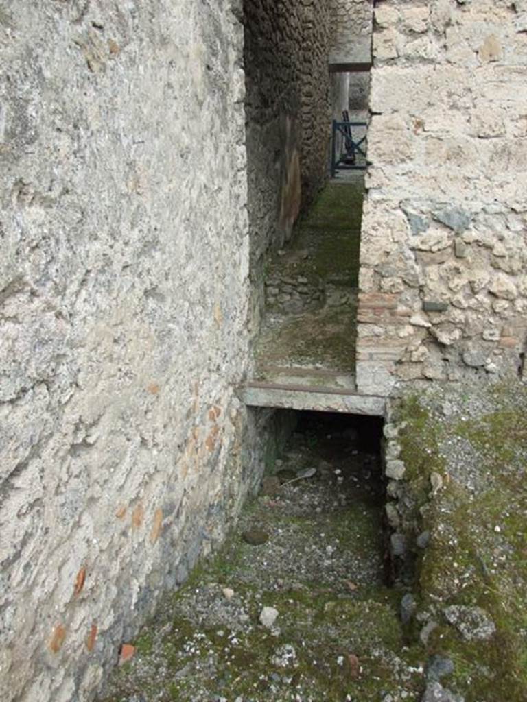I.9.1 Pompeii. March 2009. 
Peristyle 13, north-west corner of garden area, looking north to room 6, 5 and 4, (above) and stairs to lower level (below).