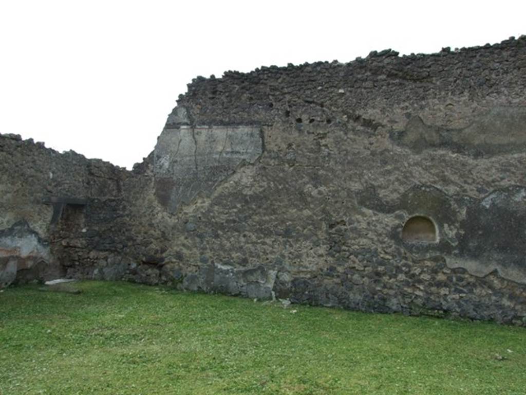 I.9.3 Pompeii.  March 2009. Room 6, west wall of garden area, and doorway in south-west corner to room 7.