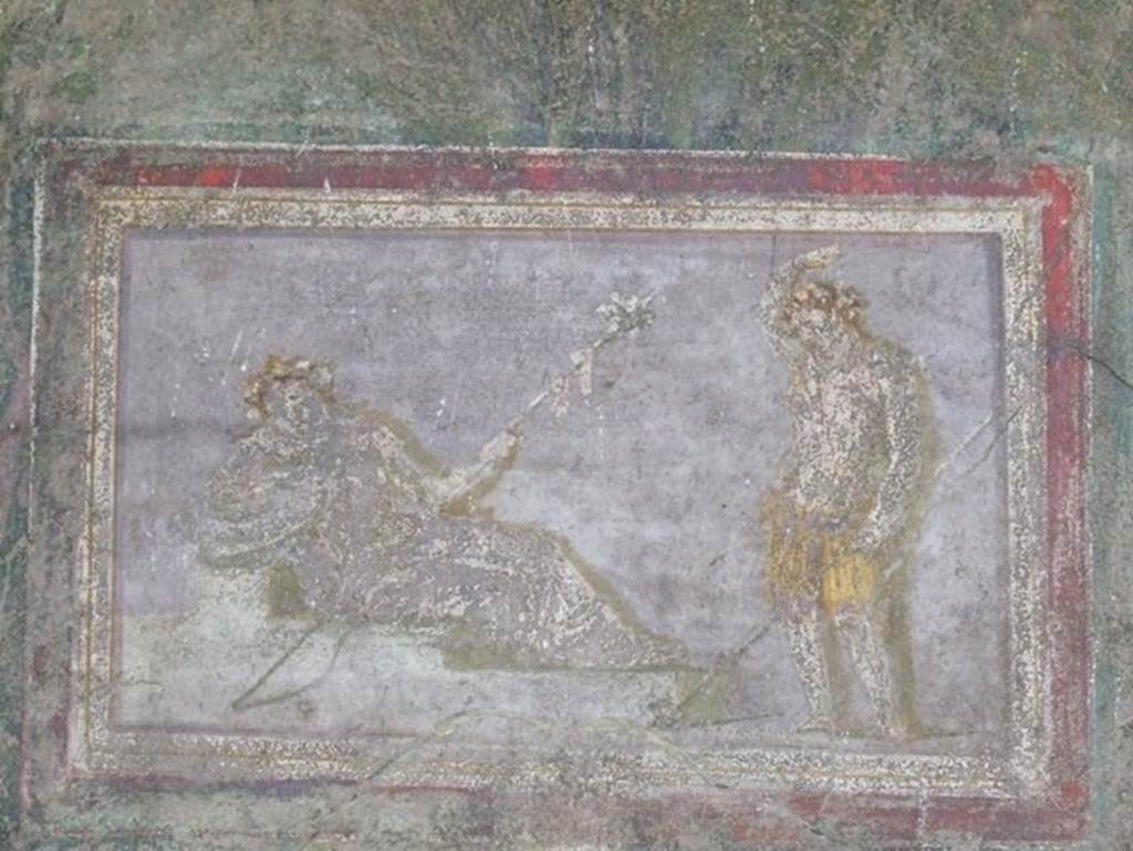 I.9.5 Pompeii. March 2009. Room 5, cubiculum. East wall. Painting of Dionysus and maenad, or Ariadne.
See Bragantini, de Vos, Badoni, 1981. Pitture e Pavimenti di Pompei, Parte 1. Rome: ICCD. (p.95).
Kuivalainen describes -  
“A composition of two whitish figures on a light grey background. On the left, a female in yellowish robe reclines on a stepped platform, leaning on her right arm; in her left hand she holds a thyrsus; her head, adorned with a wreath of ivy, is depicted frontally. On the right stands a youth wearing only a yellow loincloth; he raises his right hand on top of his head, while the left hand holds a thyrsus with a ribbon, and possibly a pine cone at the bottom. The two thyrsi are depicted in parallel lines.”
Kuivalainen comments –
“It is not unusual for the standing young Bacchus to raise his right arm above his head, as in several other paintings. The reclining fully robed figure is most likely Ariadne.”
See Kuivalainen, I., 2021. The Portrayal of Pompeian Bacchus. Commentationes Humanarum Litterarum 140. Helsinki: Finnish Society of Sciences and Letters, (p.144-5, E5).