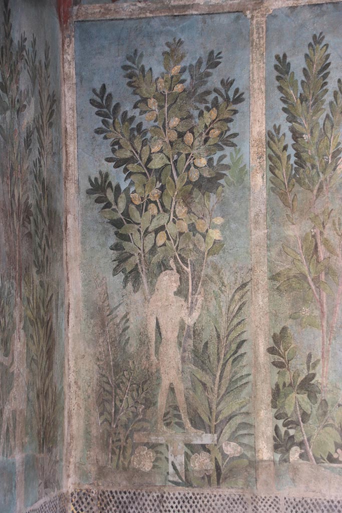 I.9.5 Pompeii. October 2024. 
Room 5, painting of Egyptian pharaonic statue and lemon tree from north end of east wall of cubiculum.
Photo courtesy of Klaus Heese