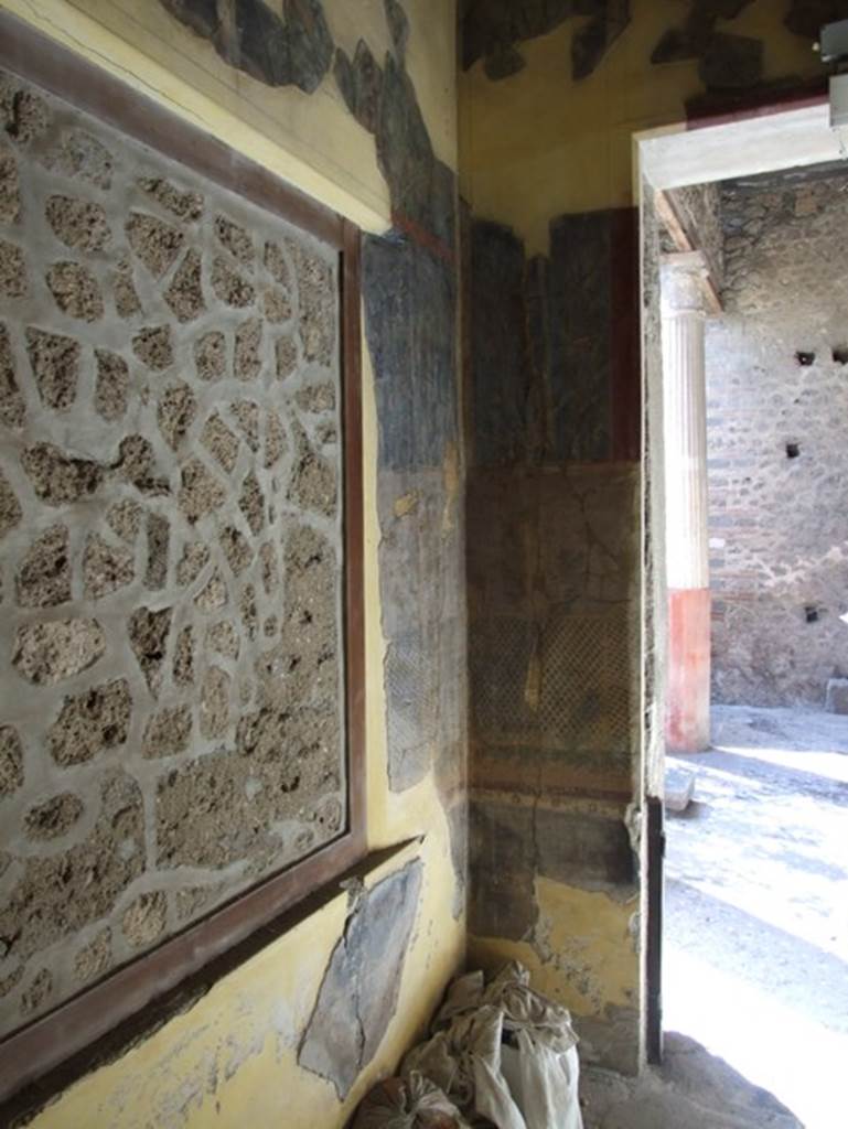 I.9.5 Pompeii. March 2009. Room 11, cubiculum. South-west corner and west wall with doorway. 