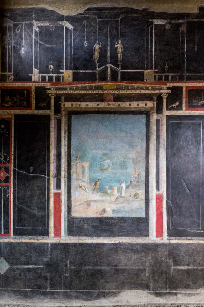 I.9.5 Pompeii. April 2022. 
Room 10, triclinium, east wall with central painting. Photo courtesy of Johannes Eber.
