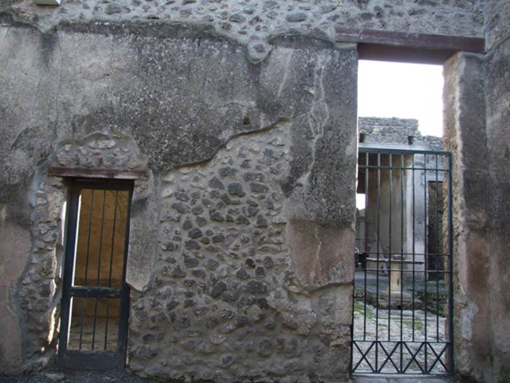 I.9.6 Pompeii. December 2007. South wall.  Doorway on the left is to cubiculum of I.9.5. Doorway on the right is to the atrium of I.9.5.