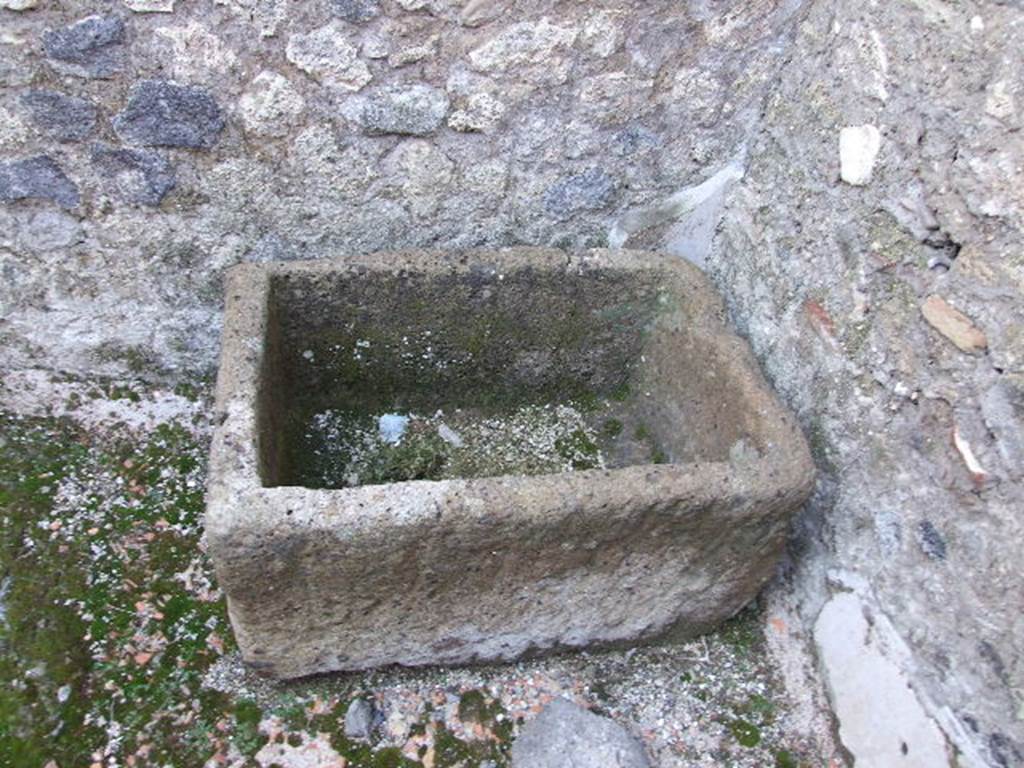 I.9.8 Pompeii. December 2006. Stone trough in rear room.