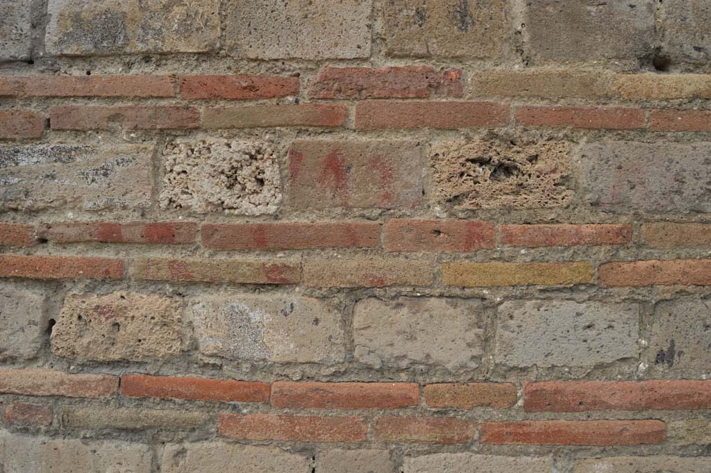 I.9.11 Pompeii. October 2017. Detail of (painted inscription on?) masonry on east (right) pilaster from entrance doorway.
Foto Taylor Lauritsen, ERC Grant 681269 DÉCOR.