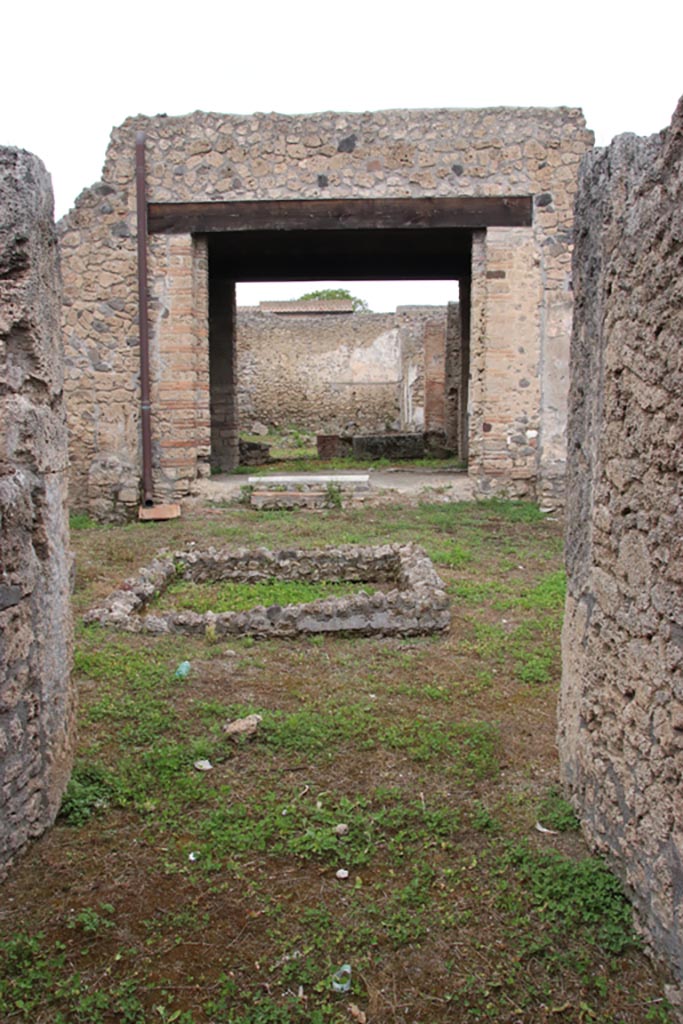 I.9.12 Pompeii. May 2024. 
Looking north across atrium towards tablinum, from entrance corridor/fauces. Photo courtesy of Klaus Heese.