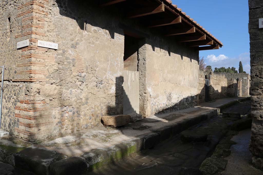 I.9.13 Pompeii. December 2018. 
Looking north-east towards entrance doorway on north side of Via di Castricio. Photo courtesy of Aude Durand.