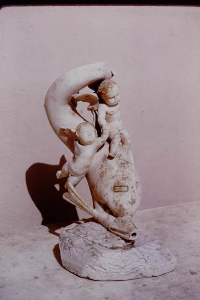 I.9.14 Pompeii. 1966. Two cupids riding on dolphin.  Photo by Stanley A. Jashemski.
Source: The Wilhelmina and Stanley A. Jashemski archive in the University of Maryland Library, Special Collections (See collection page) and made available under the Creative Commons Attribution-Non Commercial License v.4. See Licence and use details.
J66f0736