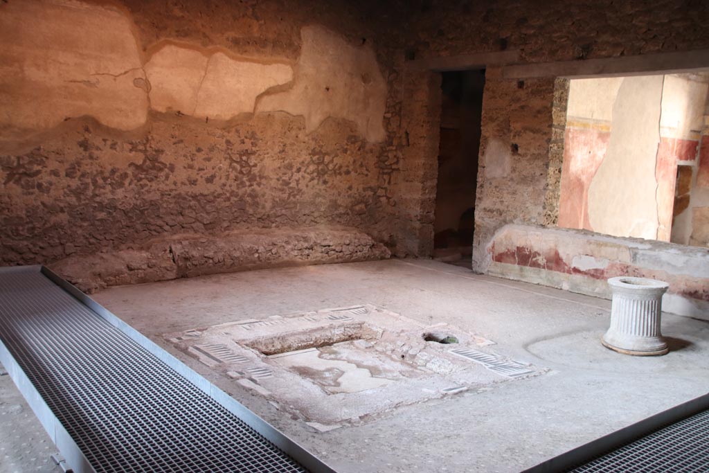 I.9.14 Pompeii. October 2022. 
Room 8, looking north-west across impluvium in atrium towards doorway to room 9, and window from tablinum. Photo courtesy of Klaus Heese.