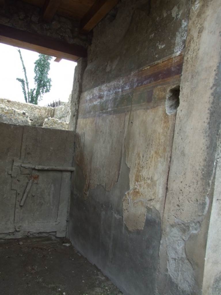 I.9.14 Pompeii. March 2009.  Room 14. West wall of fauces, and plaster cast of inside of front door to I.9.13