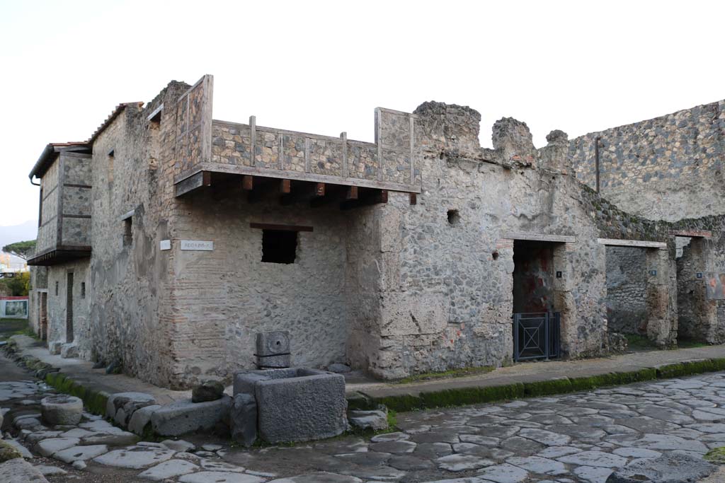 I.10.1 Pompeii, in centre, I.10.2 and 3, on right. December 2018. 
Looking south at junction of Vicolo del Menandro, on right, with Vicolo di Paquius Proculus (on left). Photo courtesy of Aude Durand.