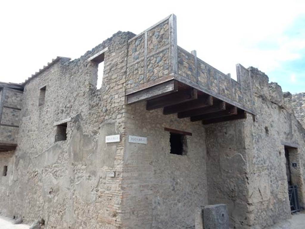 I.10.1 Pompeii, on right. May 2017.  Looking south-west towards upper floor, with reconstructed balcony. Photo courtesy of Buzz Ferebee.