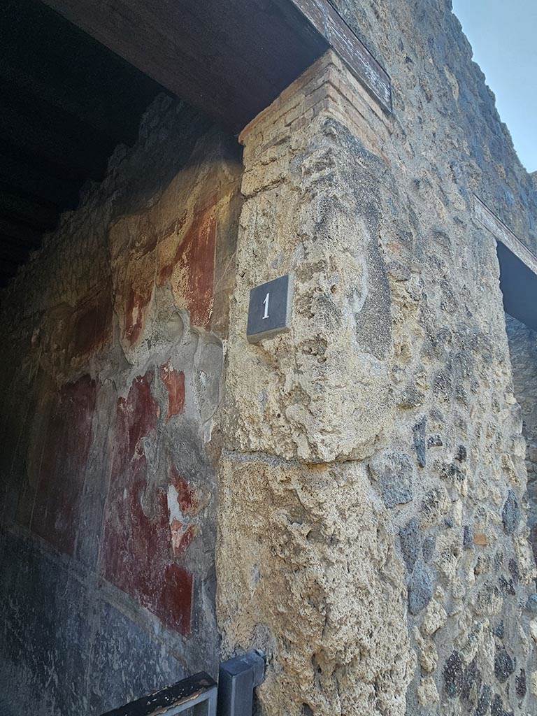 I.10.1, Pompeii. November 2024. 
West side of entrance doorway with identification number-plate. Photo courtesy of Annette Haug.