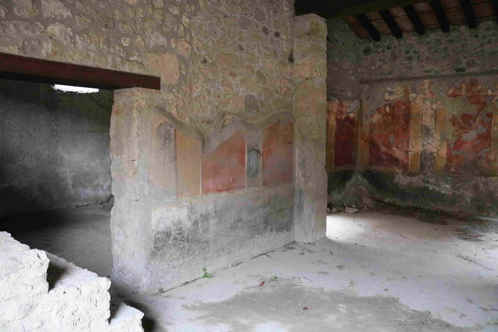 I.10.1 Pompeii. December 2018. 
Looking towards east wall of atrium with doorway to oecus and steps to upper floor, on left. On the right would be a doorway to a cubiculum.
Photo courtesy of Aude Durand.