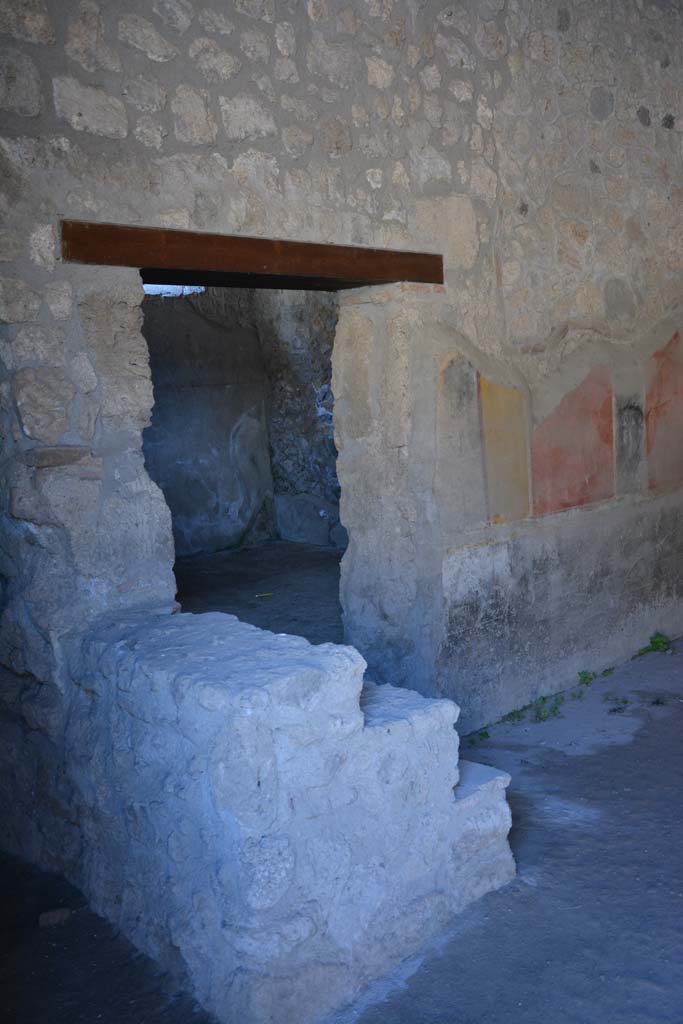 I.10.1 Pompeii. April 2017. Looking towards doorway to oecus, and steps to upper floor against east wall. 
Photo courtesy Adrian Hielscher.
