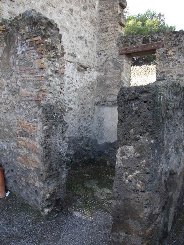 I.10.3 Pompeii. December 2005. 
Cubiculum, room on west side of entrance corridor, (room 5 on plan), with window overlooking Vicolo del Menandro.
The doorway is to be found on the north wall of the atrium.