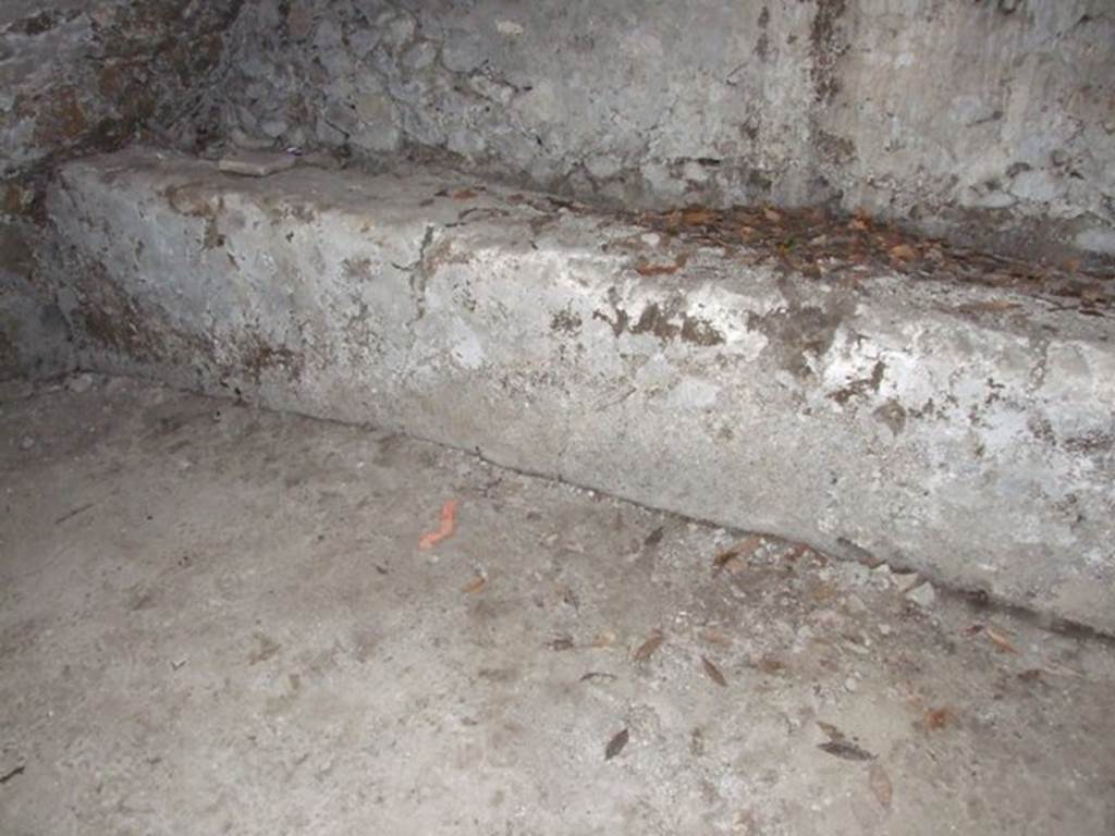 I.10.4 Pompeii.  March 2009.  Second Lower storeroom B.  North wall.  West end of bench against north wall.  The chest containing the famous silver collection was found approximately where the red mark is shown on the floor.