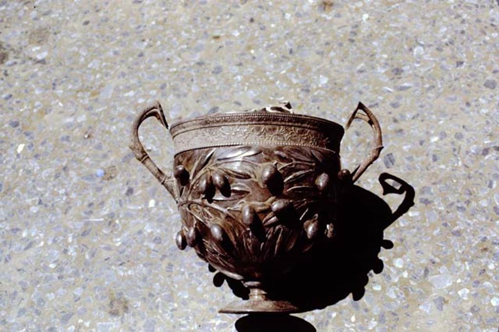 I.10.4 Pompeii. 1971. Silver cup decorated with olives.  Photo by Stanley A. Jashemski.
Source: The Wilhelmina and Stanley A. Jashemski archive in the University of Maryland Library, Special Collections (See collection page) and made available under the Creative Commons Attribution-Non Commercial License v.4. See Licence and use details. J71f0268