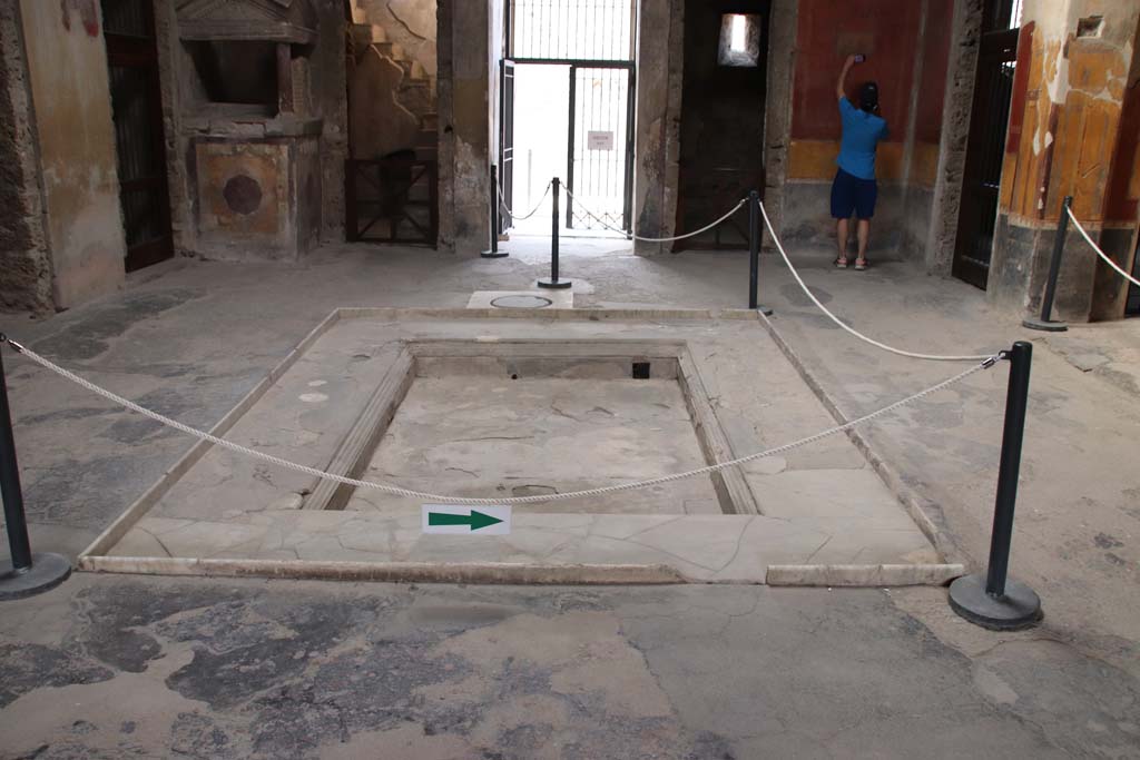 I.10.4 Pompeii. September 2021. 
Looking across impluvium towards north side of atrium and entrance doorway. Photo courtesy of Klaus Heese.