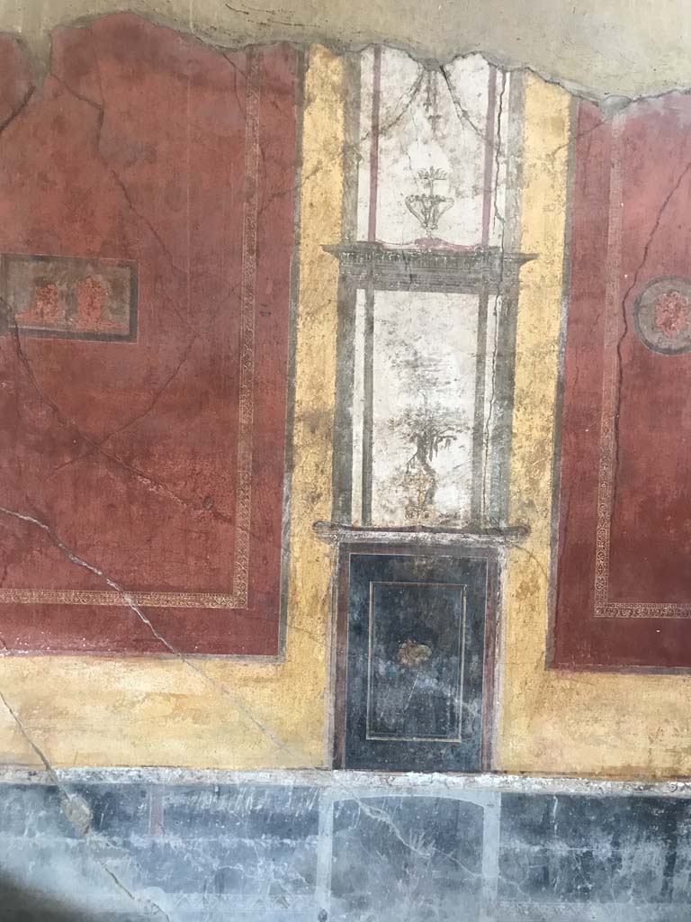 I.10.4 Pompeii. April 2019. 
Detail of west wall on south side of room 7, in south-west corner of atrium. Photo courtesy of Rick Bauer.