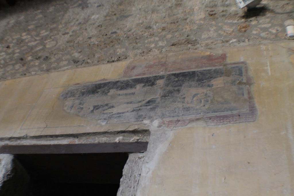 I.10.4 Pompeii. March 2014.   
Atrium, north wall in upper north-east corner, above doorway to room 1. Painted panel with architectural scene.
Foto Annette Haug, ERC Grant 681269 DÉCOR.