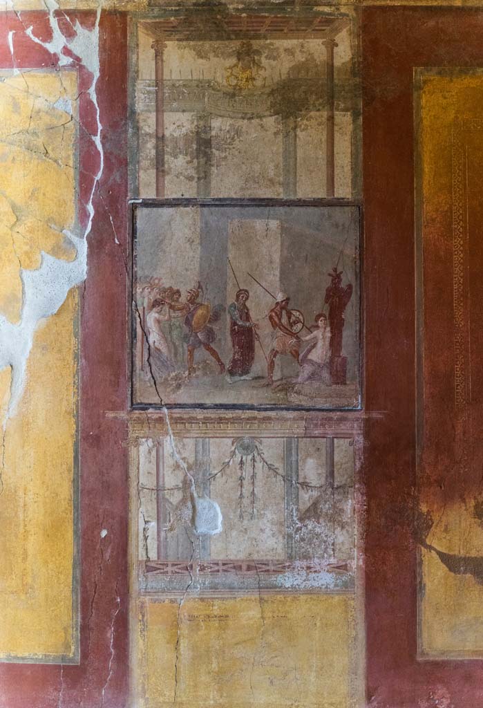 I.10.4 Pompeii. April 2022. 
Room 4, panel on north wall with mythological scene. Photo courtesy of Johannes Eber.