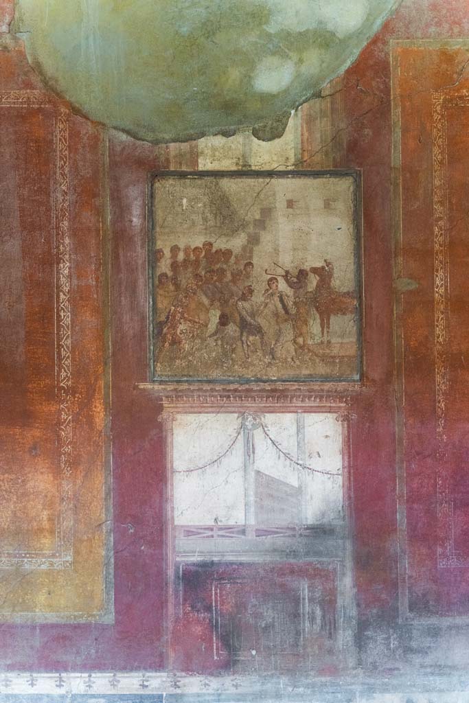 I.10.4 Pompeii. April 2022. 
Room 4, central panel on east wall with painting of Cassandra and the wooden Trojan horse.
Photo courtesy of Johannes Eber.