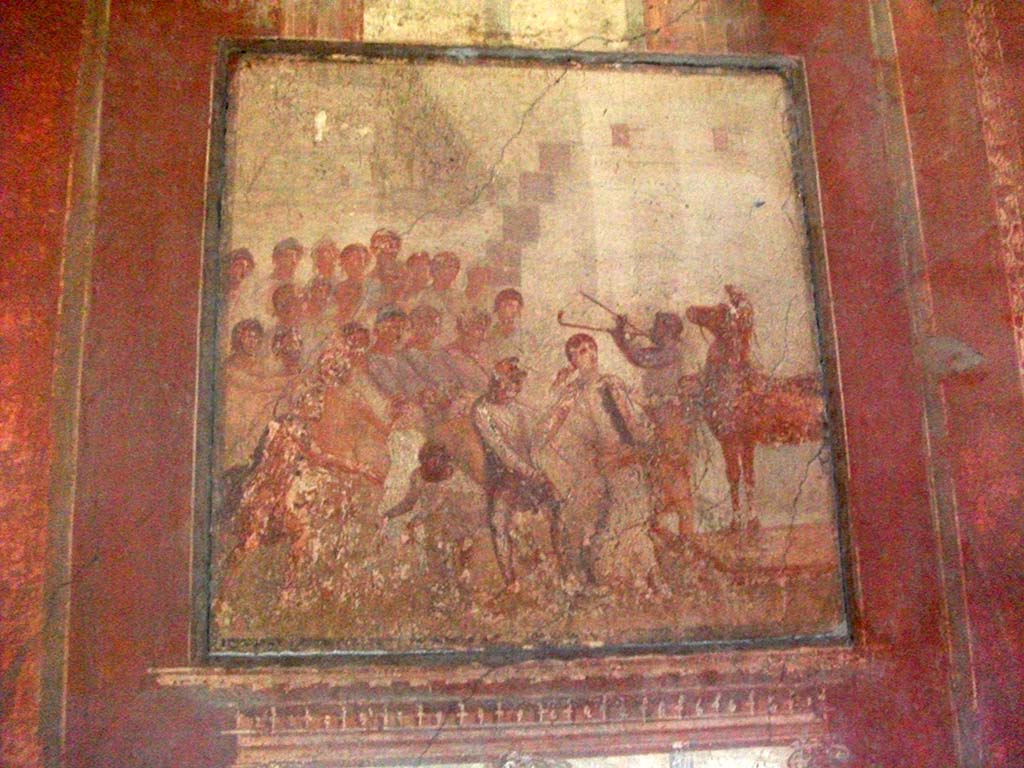 I.10.4 Pompeii. May 2010. Room 4. Wall painting of Cassandra and the wooden Trojan horse.
See Ling, R, La Casa del Menandro, in Menander, La Casa del Menandro di Pompei. Edited by G. Stefani. Milan: Electa, 2003 (p. 35). 
See Bragantini, de Vos, Badoni, 1981. Pitture e Pavimenti di Pompei, Parte 1. Rome: ICCD. (p.116).